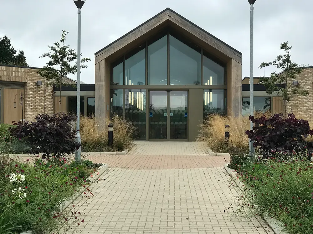 Contemplation garden at the hospice with seating niches among planting