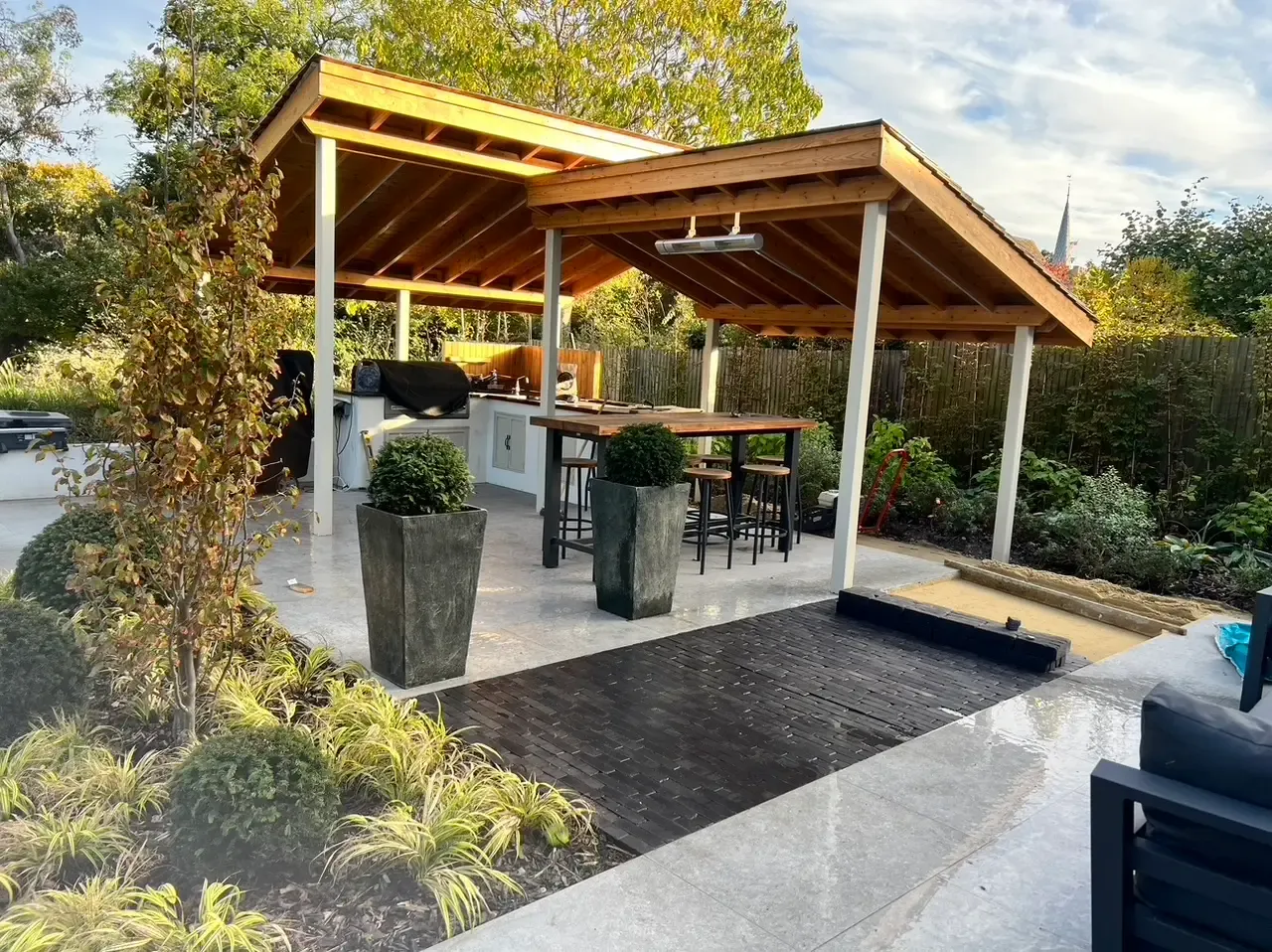 Silver porcelain and Lucca clay paver terrace with structural planting