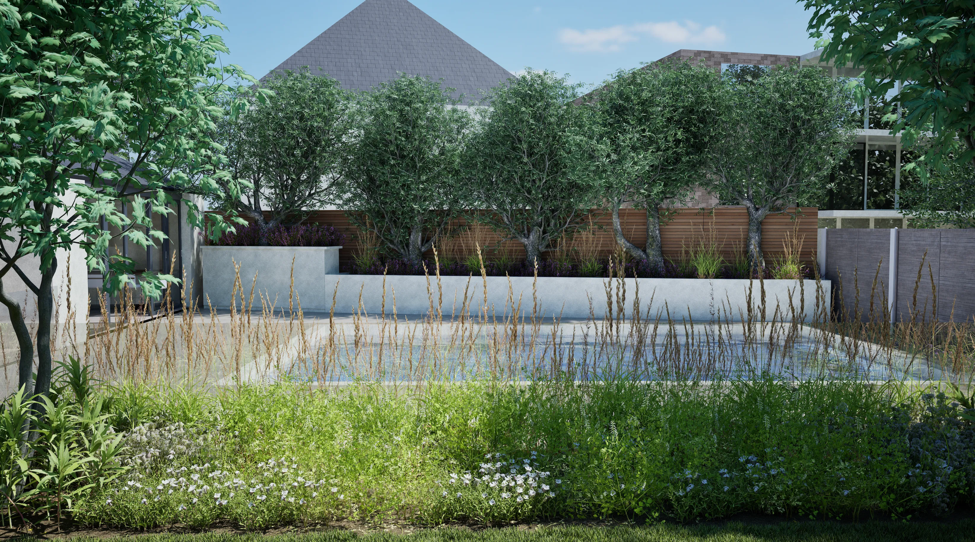 Soft lighting across planted edges and terrace materials.